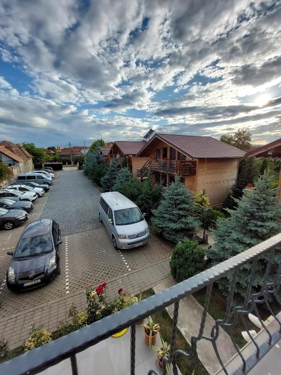 a group of cars parked in a parking lot at Daiana Residence Cabane in Turda