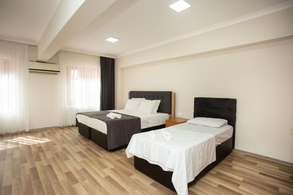 Letto o letti in una camera di Türkler Suite Hotel