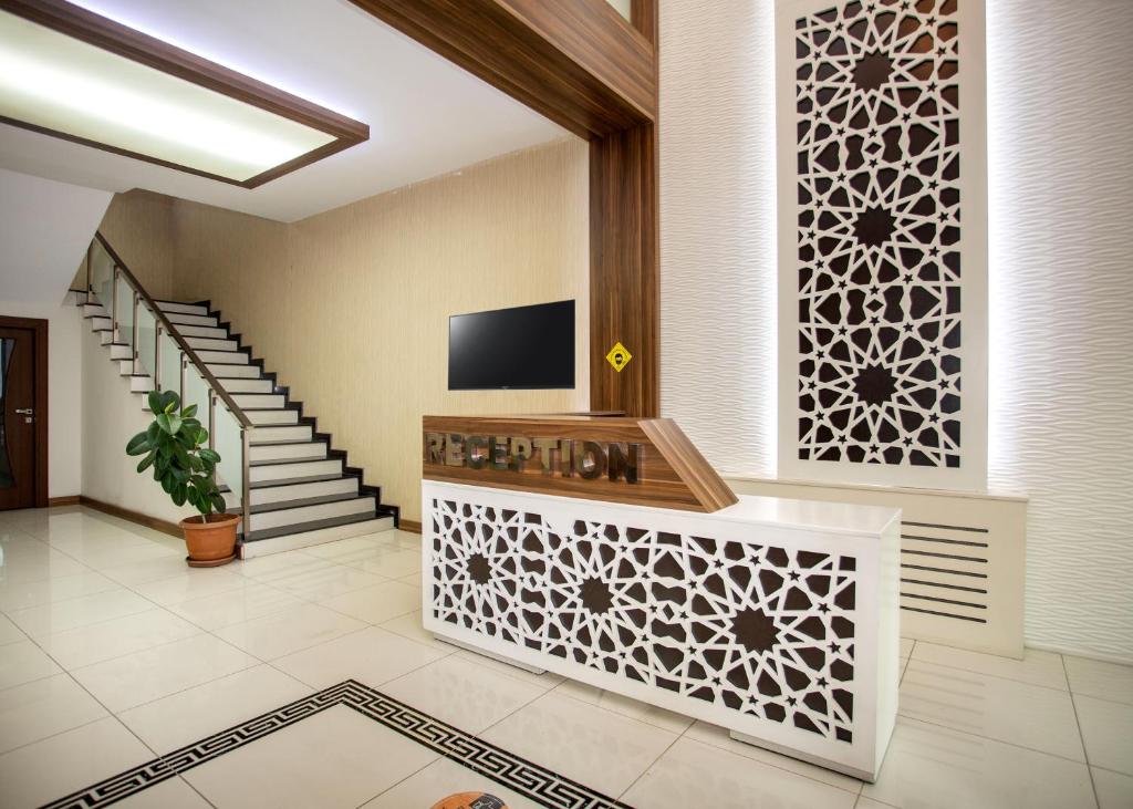 TV o dispositivi per l'intrattenimento presso Türkler Suite Hotel