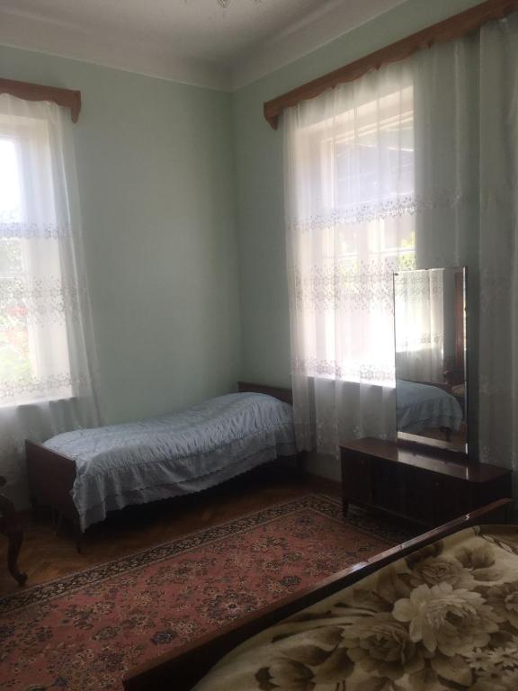 Postel nebo postele na pokoji v ubytování Guest House Kumayri