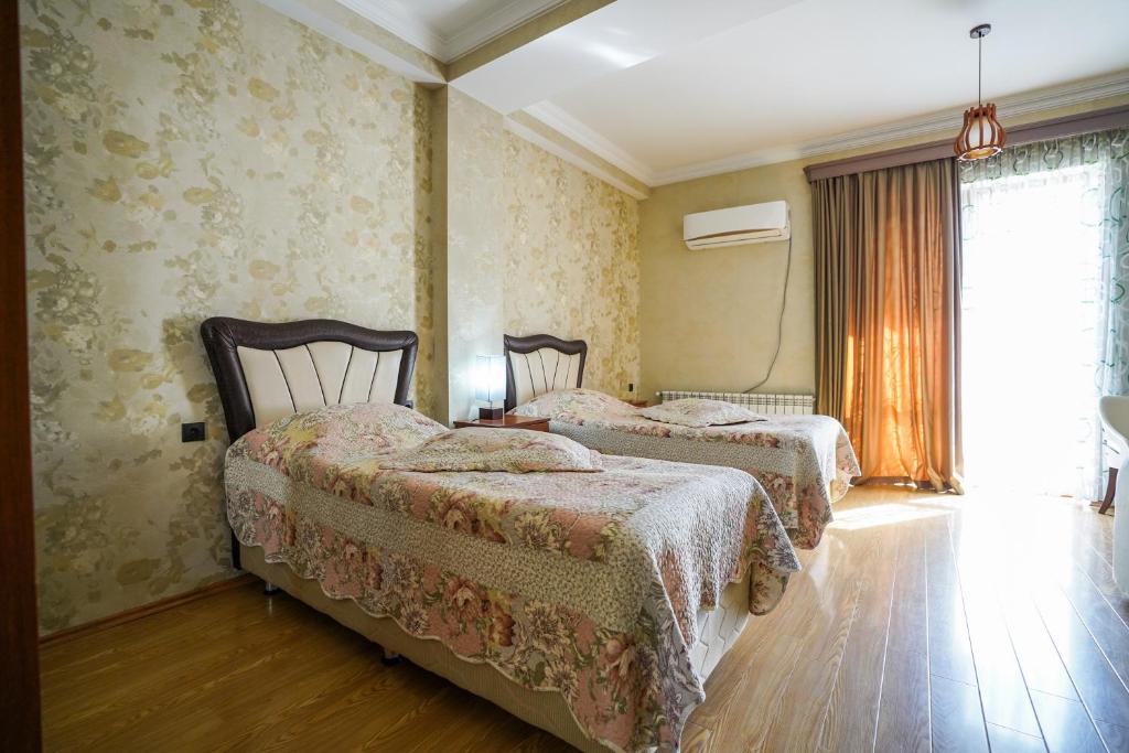 Postel nebo postele na pokoji v ubytování Natali Hotel