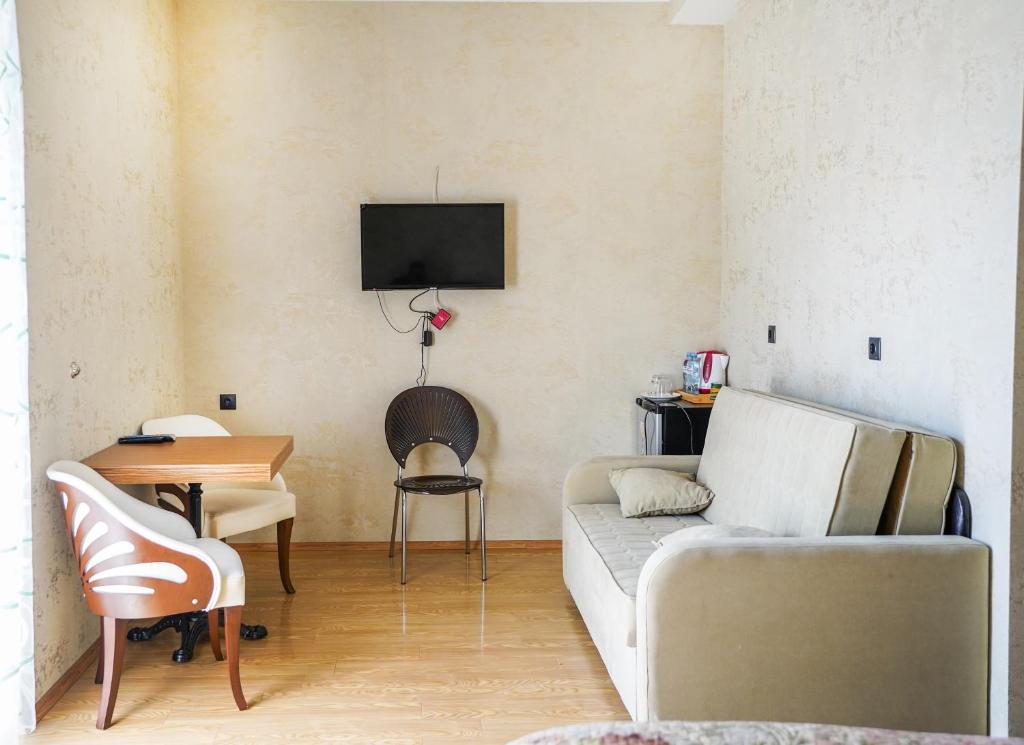 TV a/nebo společenská místnost v ubytování Natali Hotel