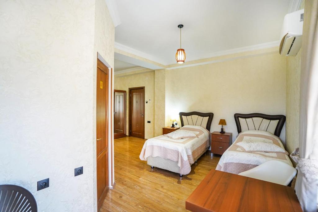 Postel nebo postele na pokoji v ubytování Natali Hotel