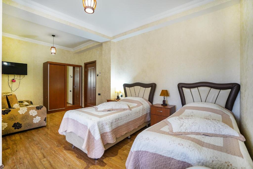 Postel nebo postele na pokoji v ubytování Natali Hotel