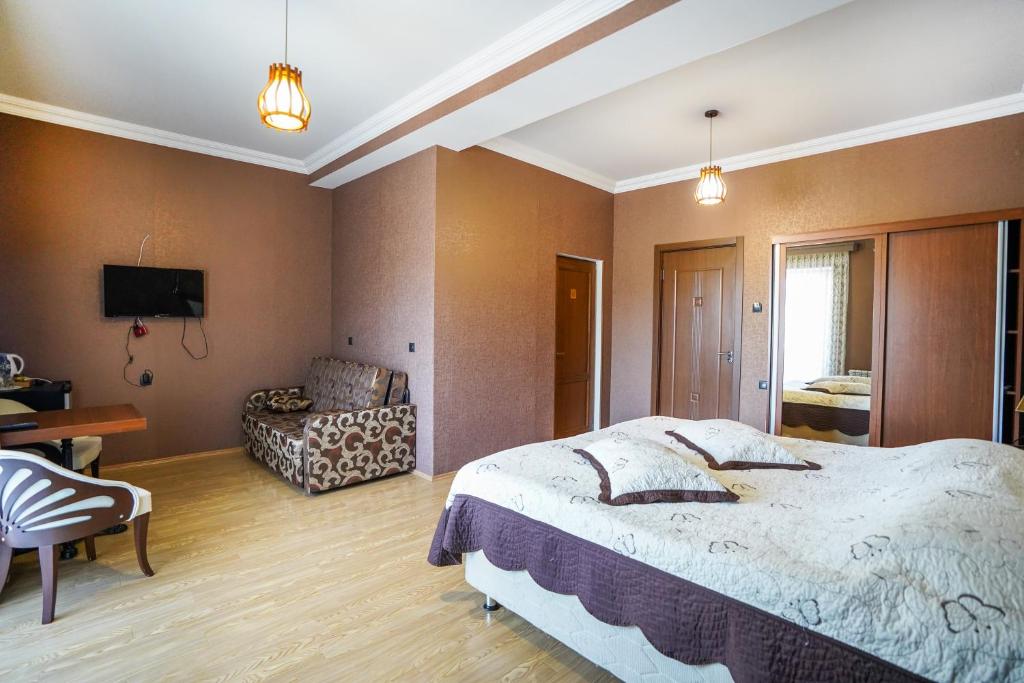 Postel nebo postele na pokoji v ubytování Natali Hotel