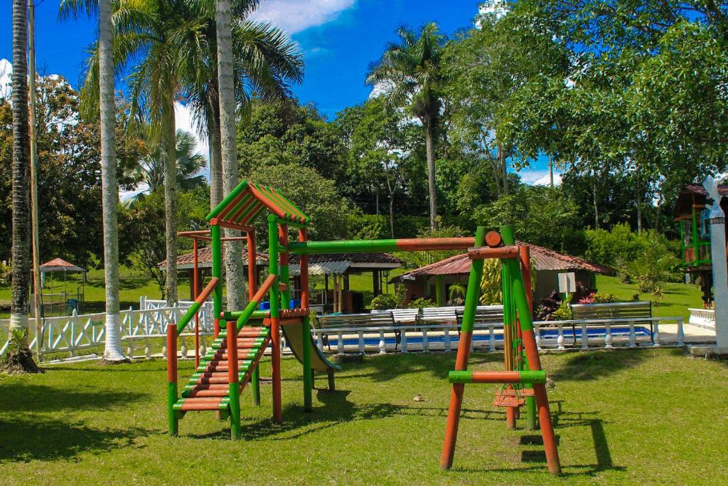 a playground with a slide in a park at Room in Guest room - Room with 2 double beds - Number 14 in Rizaralda