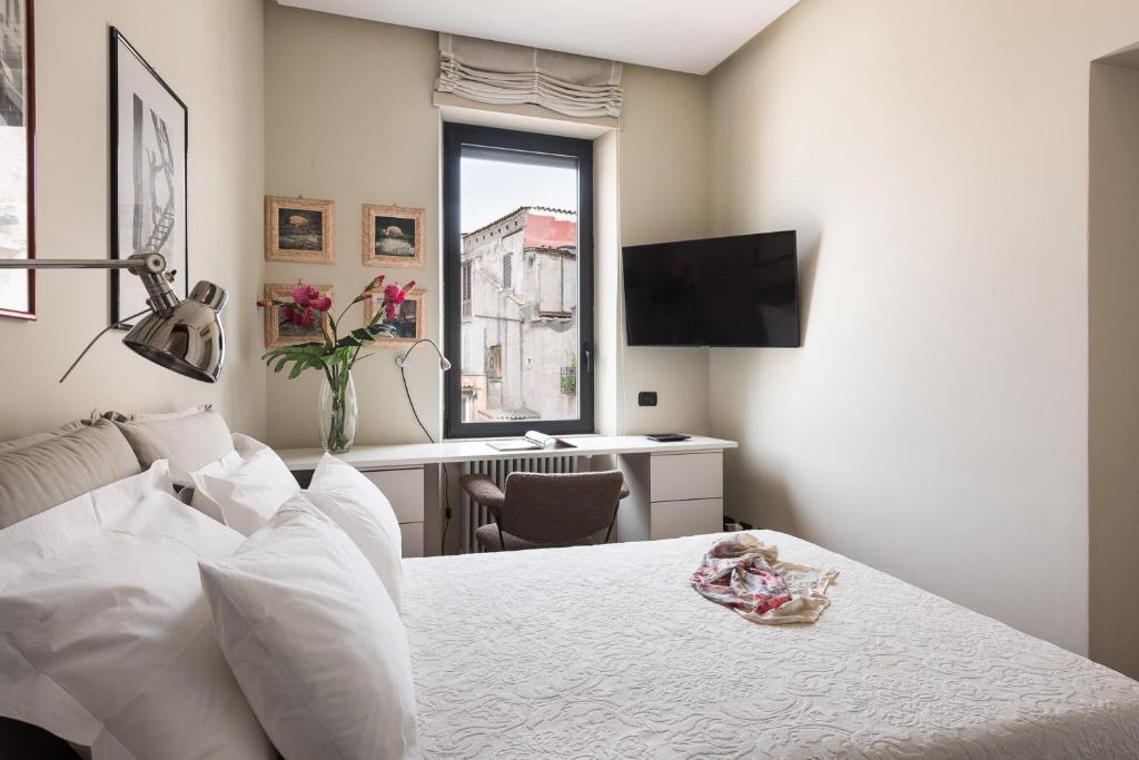 Łóżko lub łóżka w pokoju w obiekcie Idyllia - Penthouse in Navona Area