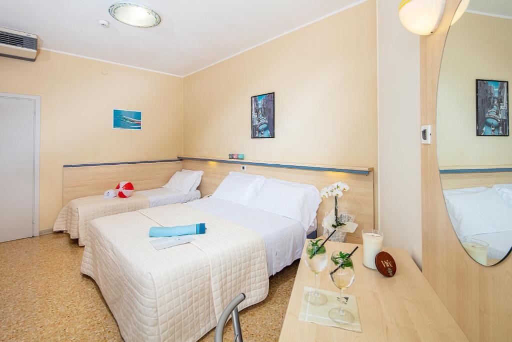 Postel nebo postele na pokoji v ubytování Hotel Condor