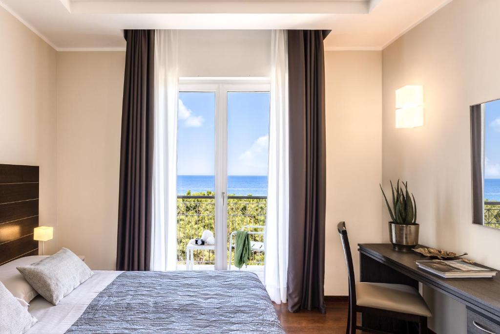 Кровать или кровати в номере Grand Hotel Spiaggia