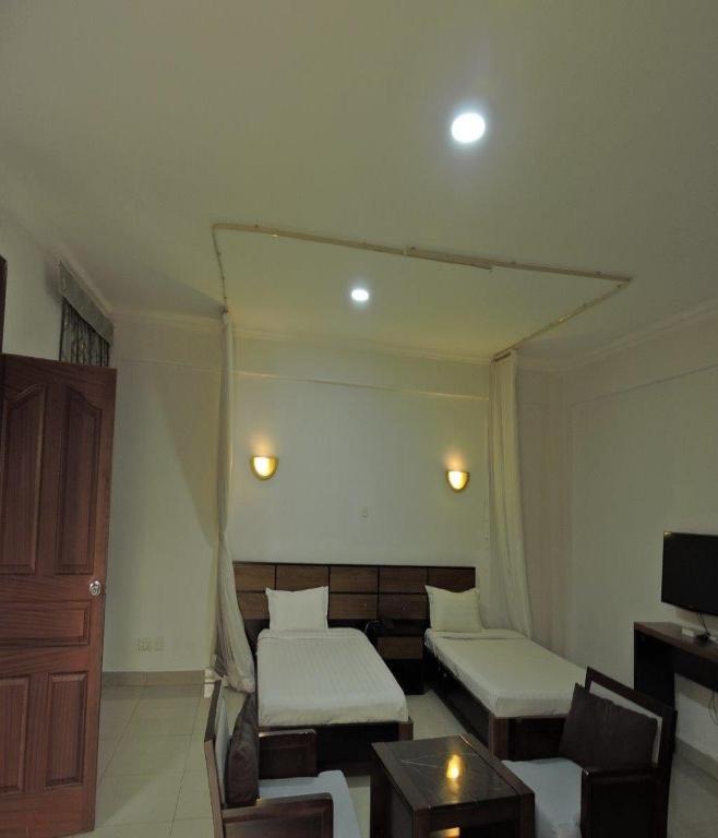 Postel nebo postele na pokoji v ubytování Sky Hotel Nairobi