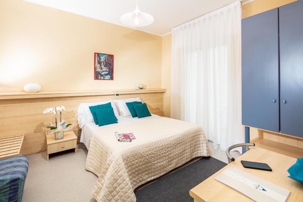 Postel nebo postele na pokoji v ubytování Hotel Condor