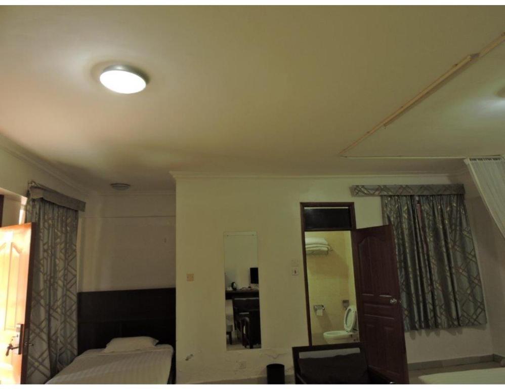 Postel nebo postele na pokoji v ubytování Sky Hotel Nairobi