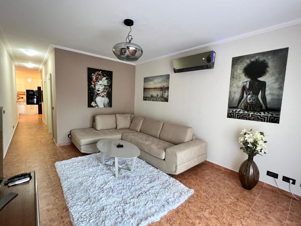 a living room with a couch and a table at Vista Petrovac in Petrovac na Moru