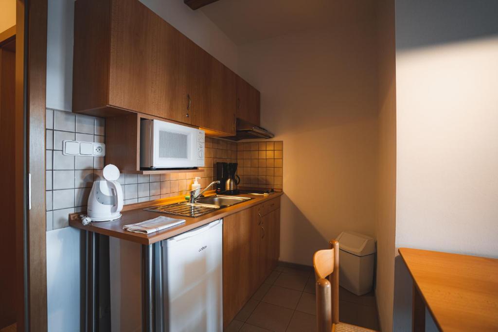Kuchyň nebo kuchyňský kout v ubytování Apartmány Jurica Boží Dar 86