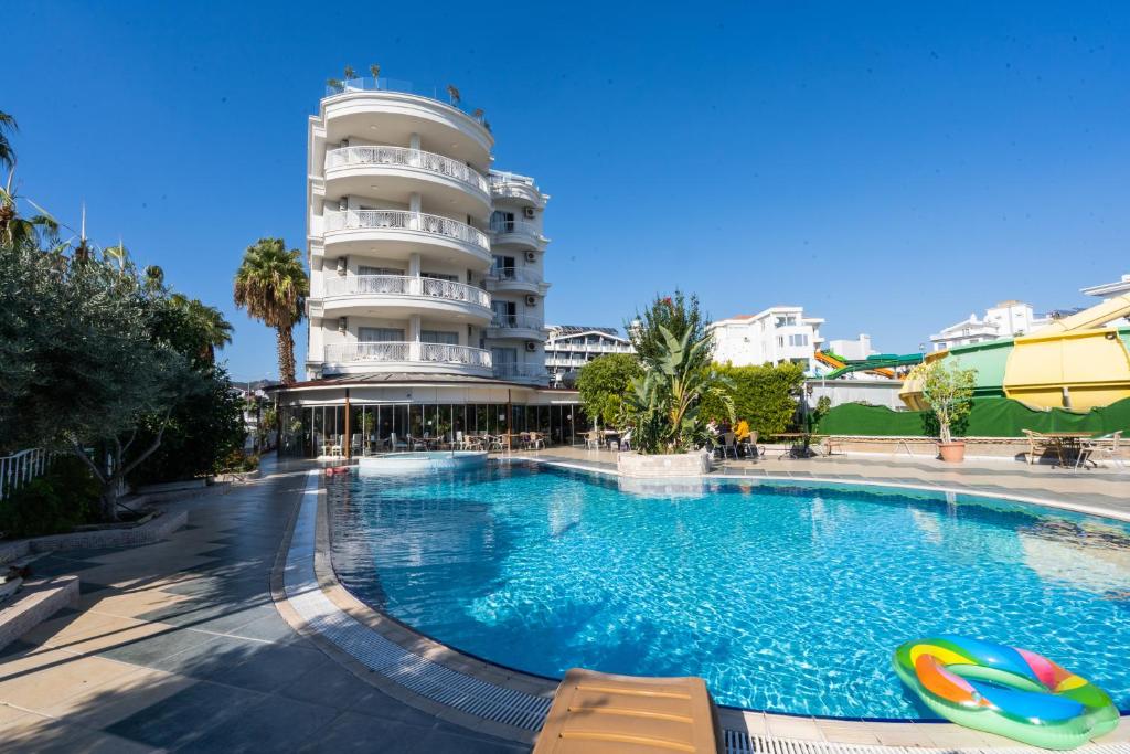 a large swimming pool in front of a building at Romance Beach Hotel in Marmaris