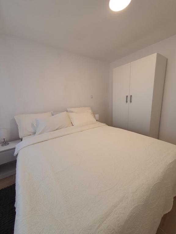 Ένα ή περισσότερα κρεβάτια σε δωμάτιο στο Apartment Vinjerac I