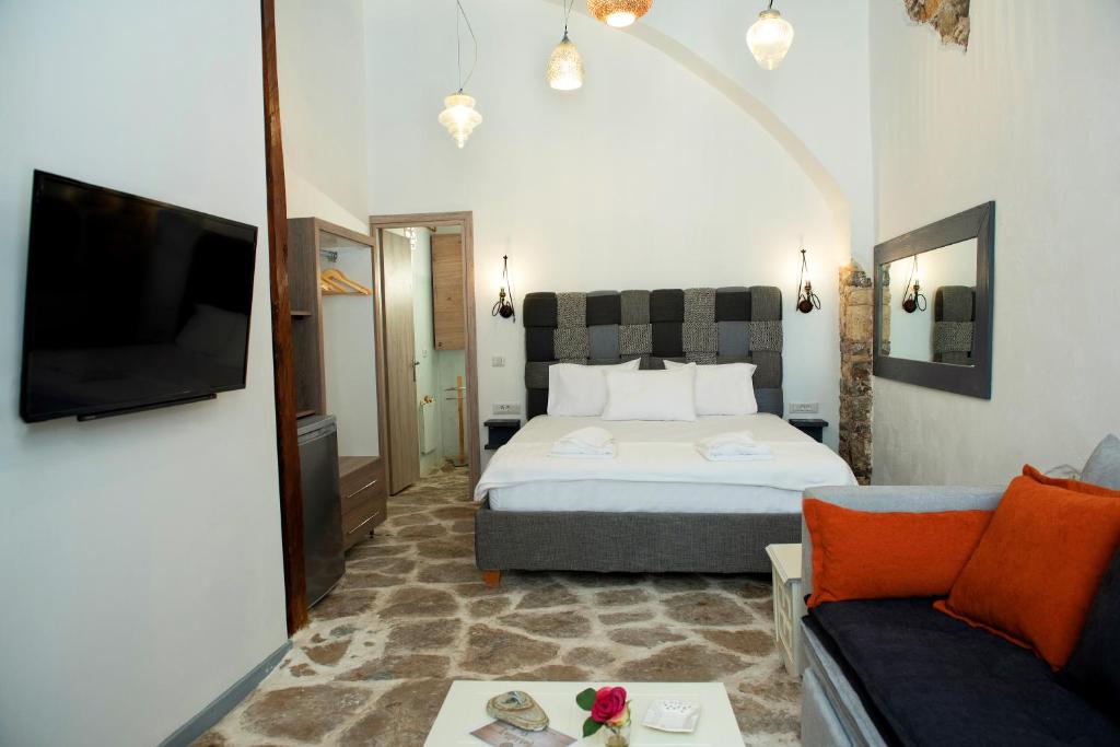 Giường trong phòng chung tại Margietta's Suites Nafplio
