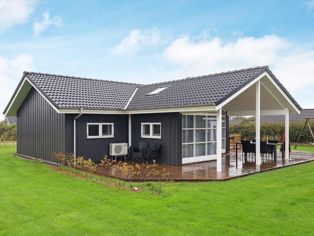 a rendering of a house with a pitched roof at 8 person holiday home in Lemvig in Lemvig