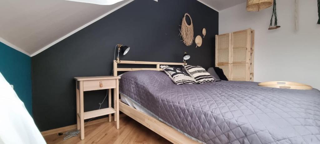 Posteľ alebo postele v izbe v ubytovaní Apartament w centrum - Nasze poddasze