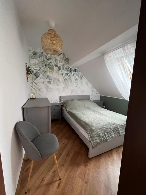 Posteľ alebo postele v izbe v ubytovaní Apartament w centrum - Nasze poddasze