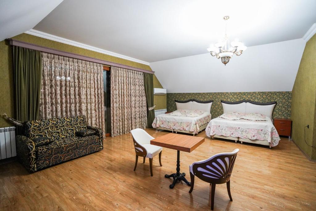 Postel nebo postele na pokoji v ubytování Natali Hotel