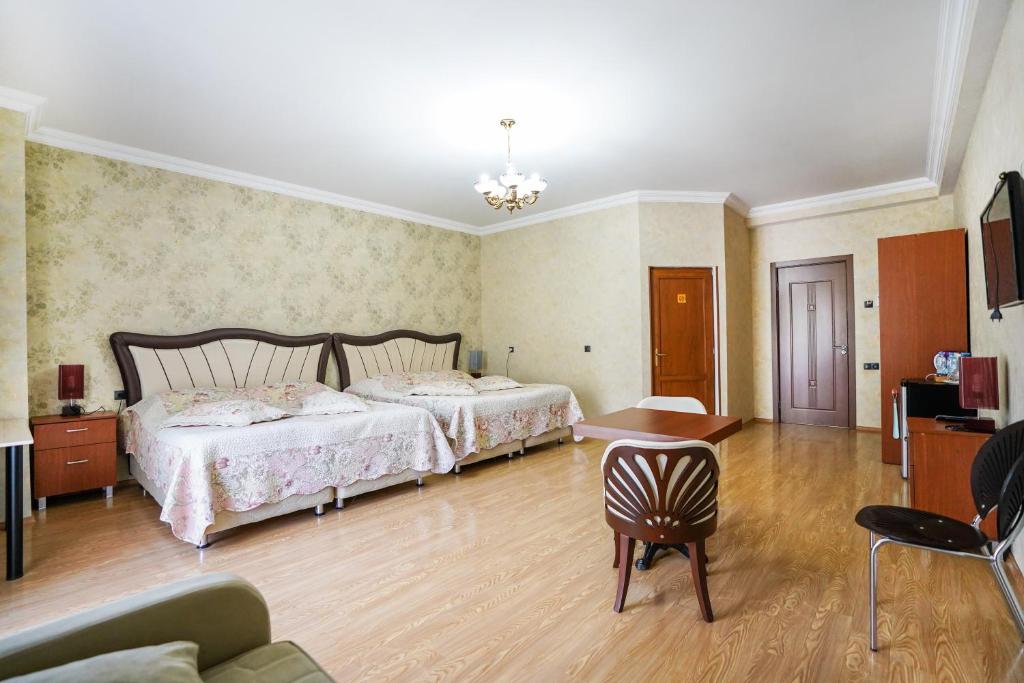 Postel nebo postele na pokoji v ubytování Natali Hotel