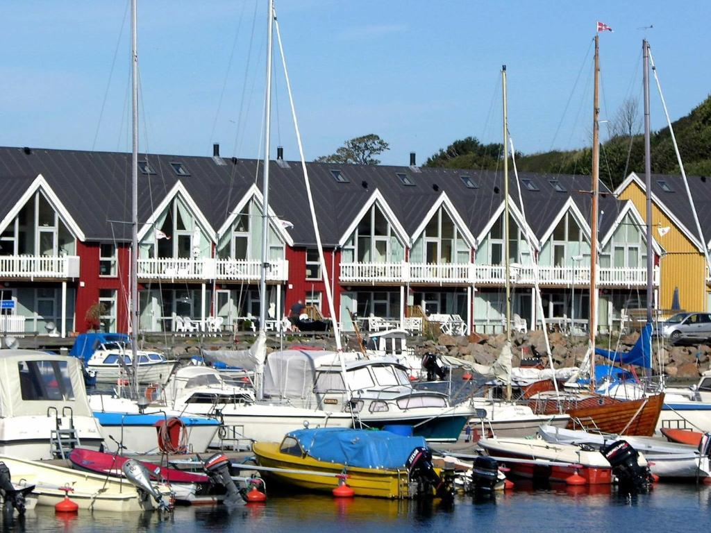 un grupo de barcos atracados frente a un puerto deportivo en 8 person holiday home in Hasle, en Hasle