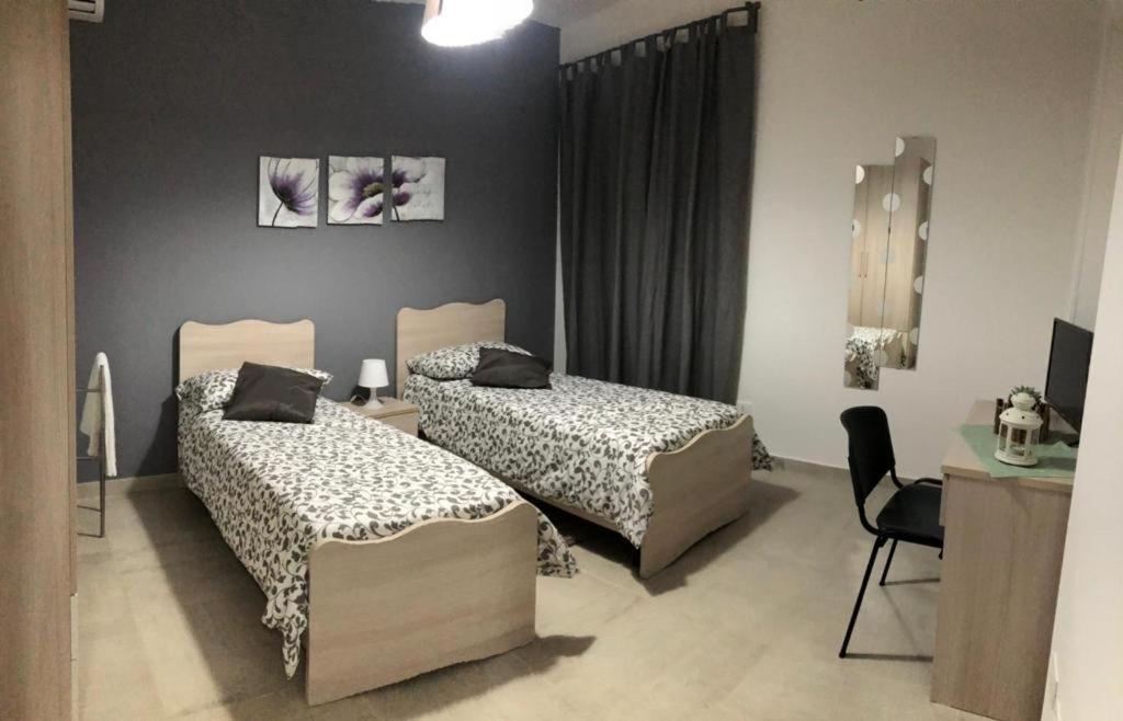 Postel nebo postele na pokoji v ubytování B&B La Casa di Violetta