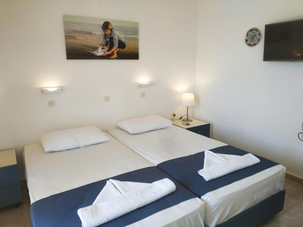 Postel nebo postele na pokoji v ubytování Hotel Narkissos