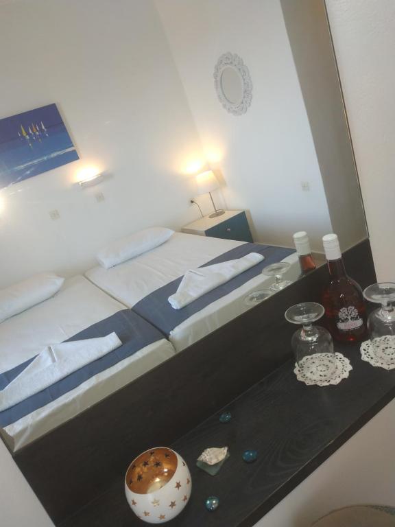 Postel nebo postele na pokoji v ubytování Hotel Narkissos