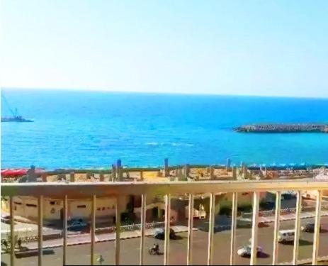 a view of the ocean from a balcony of a building at City Square Gate 4 - Ultra Apartment - Full Sea View in Alexandria