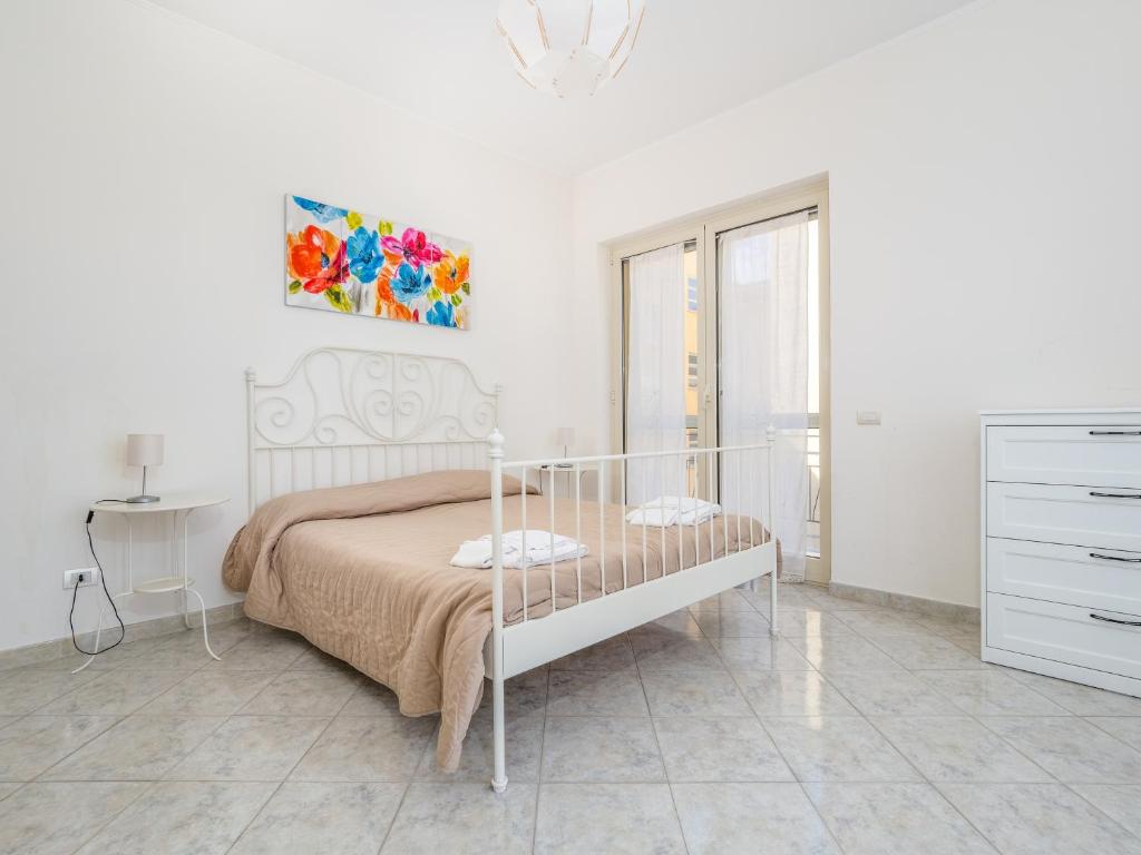 Łóżko lub łóżka w pokoju w obiekcie YourHome - Corso Italia Apt in Sorrento