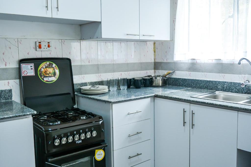 Kuchyň nebo kuchyňský kout v ubytování Brickwood Apartments