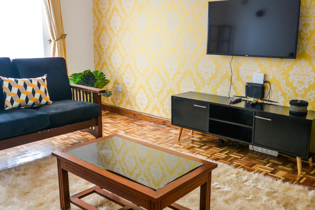 TV a/nebo společenská místnost v ubytování Brickwood Apartments