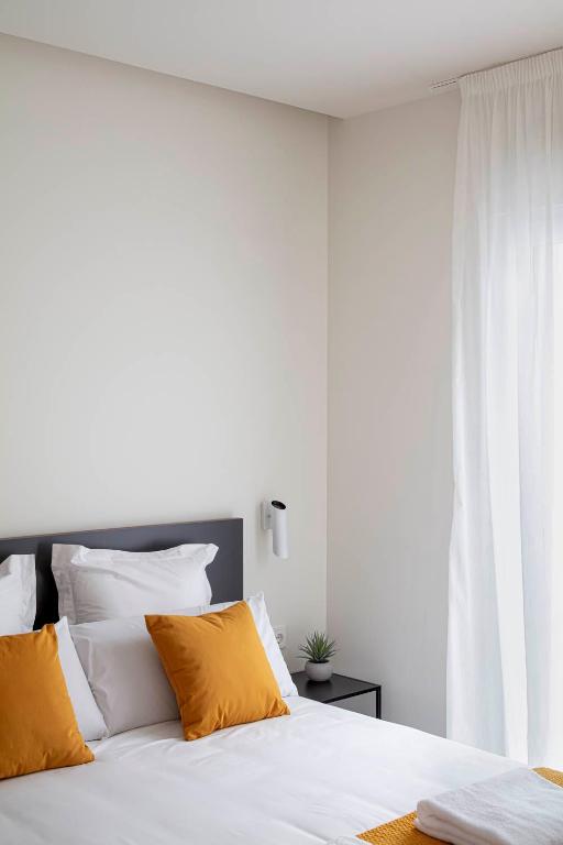 Postel nebo postele na pokoji v ubytování Invino Apartments