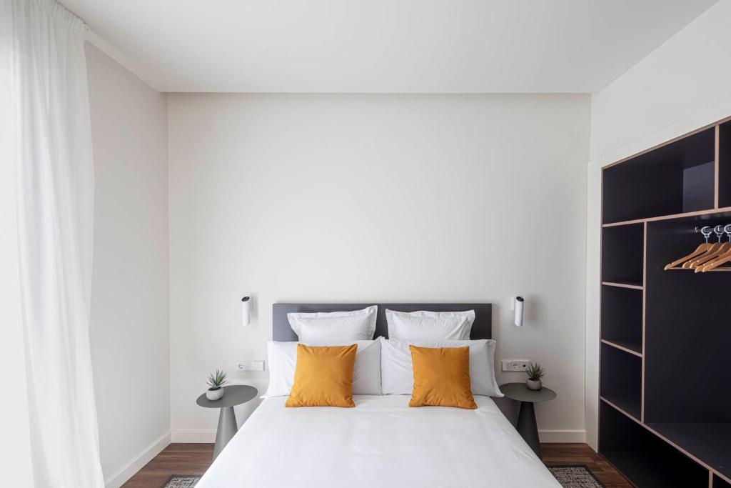 Postel nebo postele na pokoji v ubytování Invino Apartments