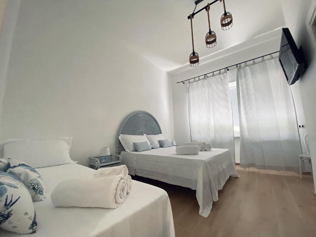 เตียงในห้องที่ Sogno Mediterraneo