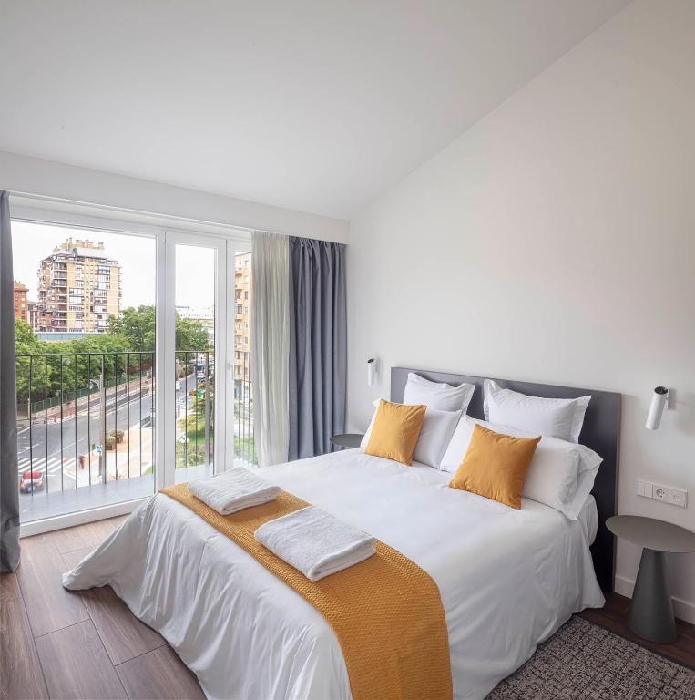 Postel nebo postele na pokoji v ubytování Invino Apartments