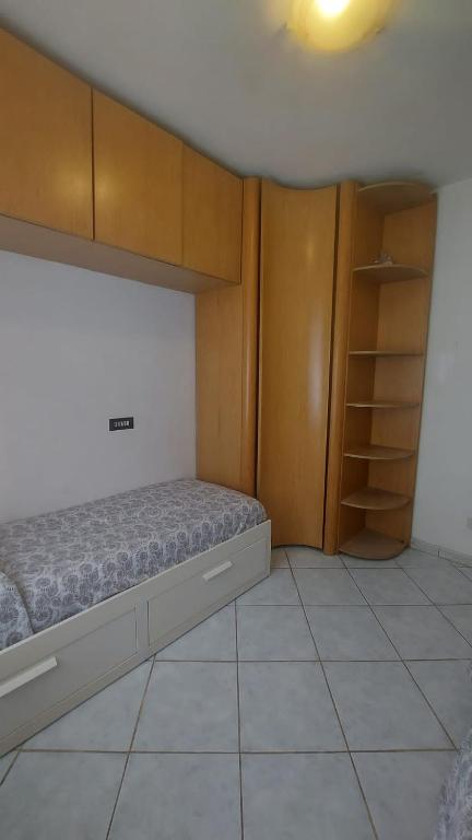 Łóżko lub łóżka w pokoju w obiekcie Casa Ariel