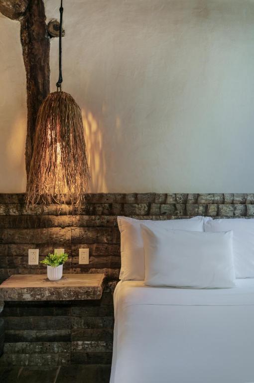 Letto o letti in una camera di Hidden Treehouse Tulum Eco-Hotel