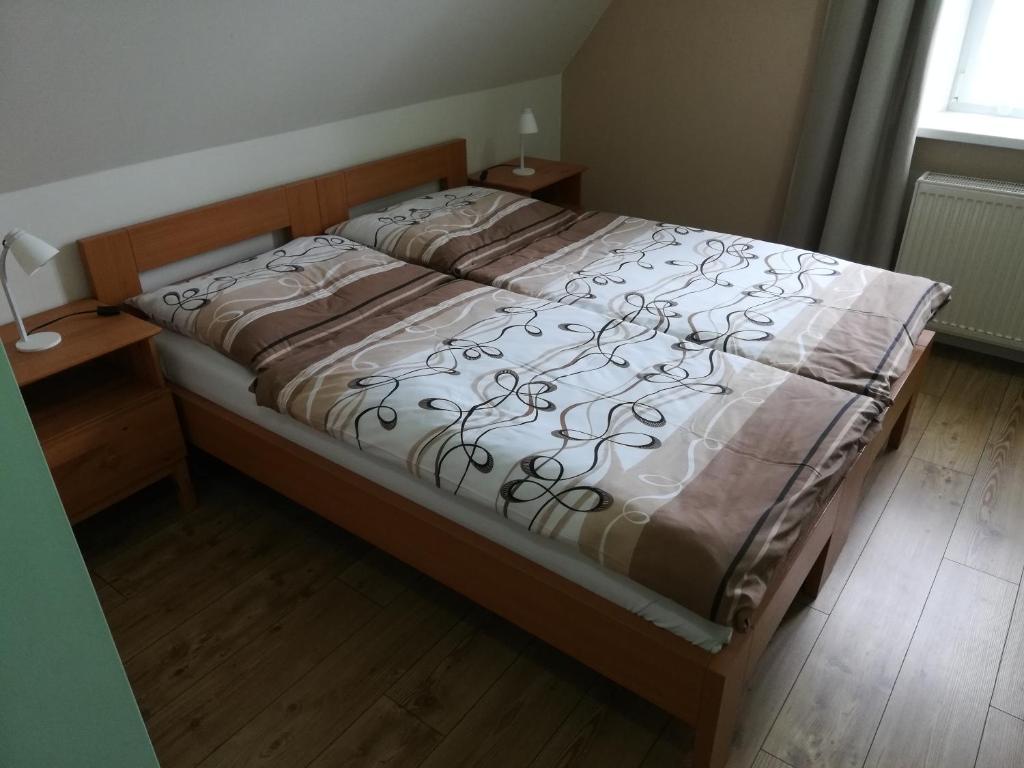 Postel nebo postele na pokoji v ubytování Lipanka
