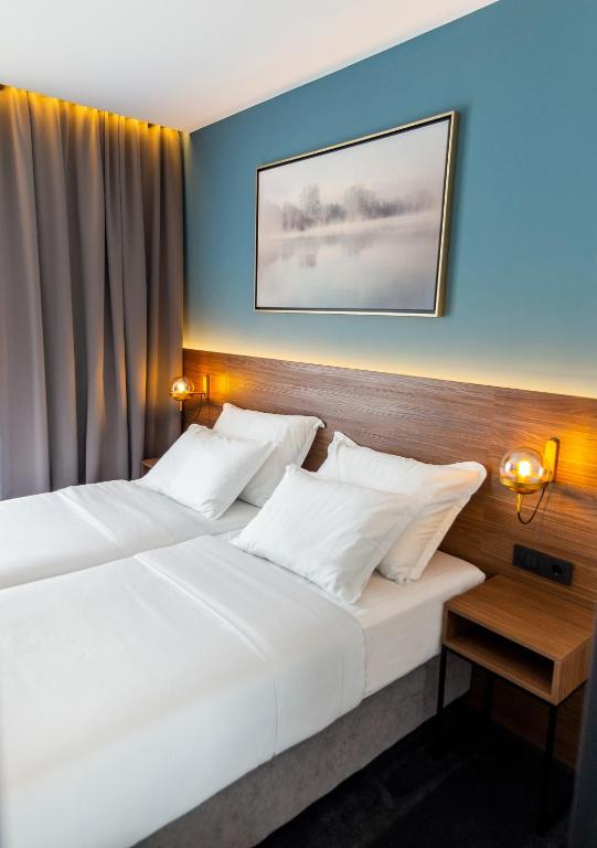 Postel nebo postele na pokoji v ubytování Boutique ROOMs 76