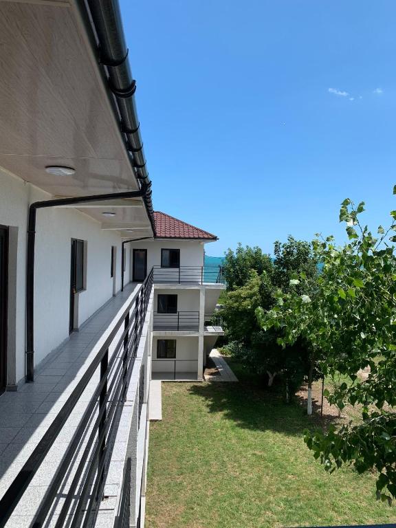 a balcony of a house with a view of the ocean at Casa Steluta de Mare in 2 Mai