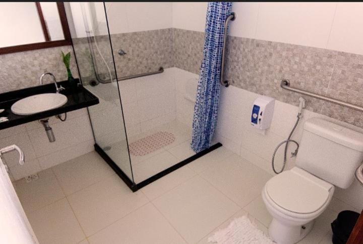 a bathroom with a shower and a toilet and a sink at Refúgio do Rio Bonito in Bonito