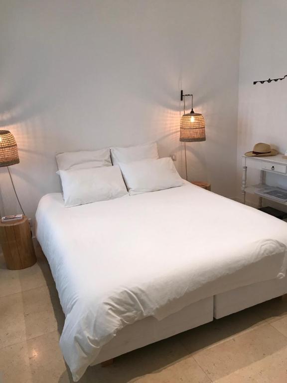 Postel nebo postele na pokoji v ubytování Maison Boussingault