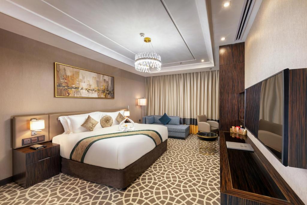Postel nebo postele na pokoji v ubytování Nivel Hotel Abha
