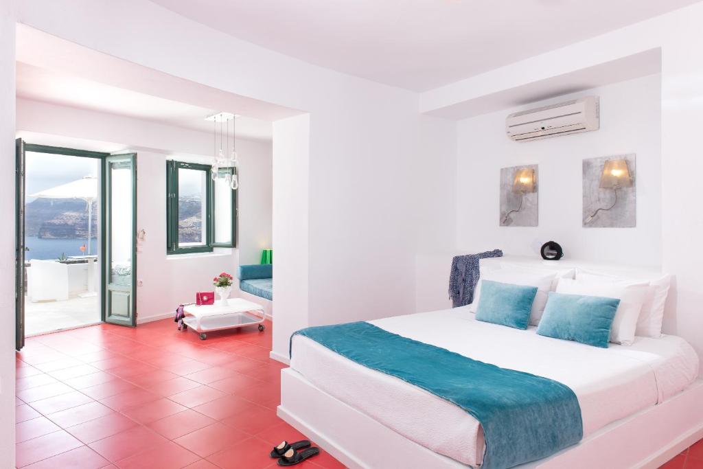 Postel nebo postele na pokoji v ubytování Avant Garde Suites