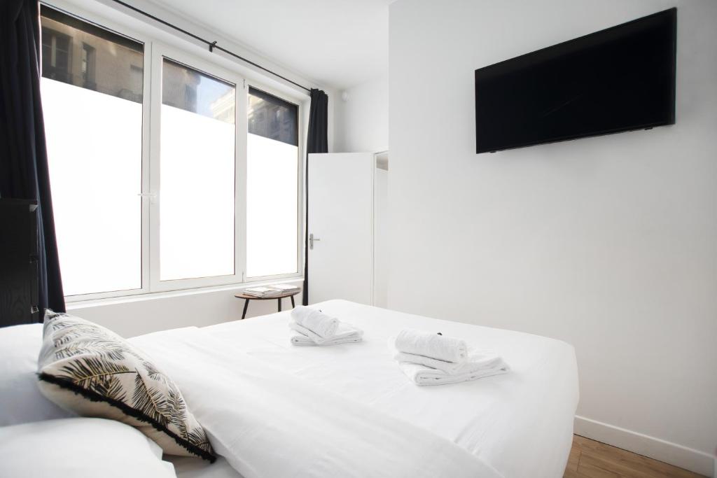 Posteľ alebo postele v izbe v ubytovaní Bel appartement idéalement situé - Tour Eiffel
