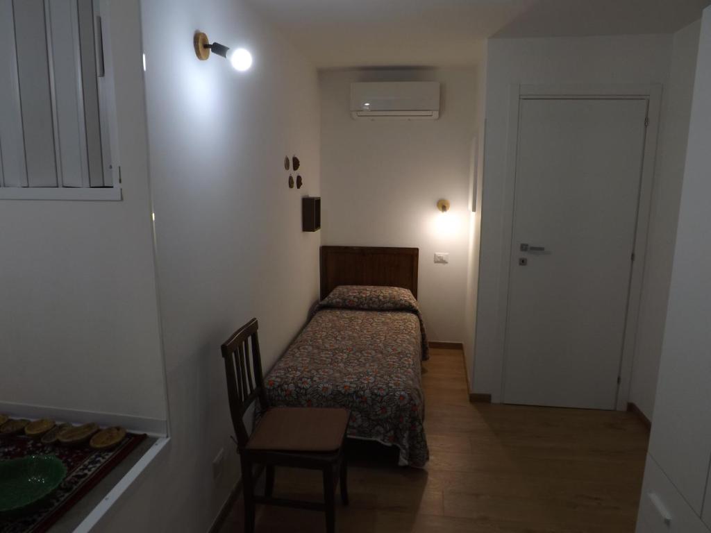 A bed or beds in a room at Via Roma 28