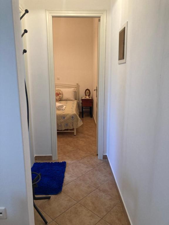 Łóżko lub łóżka w pokoju w obiekcie AGKYRA Rooms (Love)
